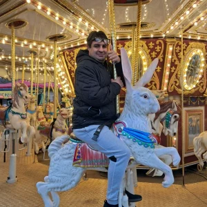 People we support and staff enjoying rides and festive activities at Winter Wonderland, Park House