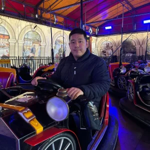 People we support and staff enjoying rides and festive activities at Winter Wonderland, Park House