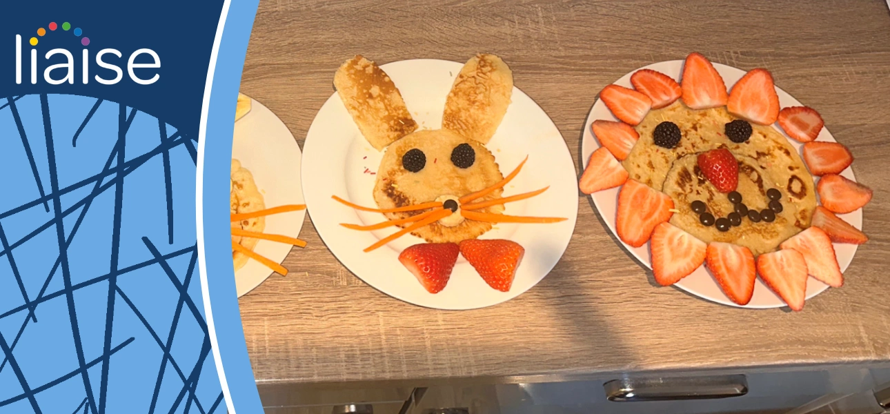 People enjoying the Pancake Day event with Liaise 2025