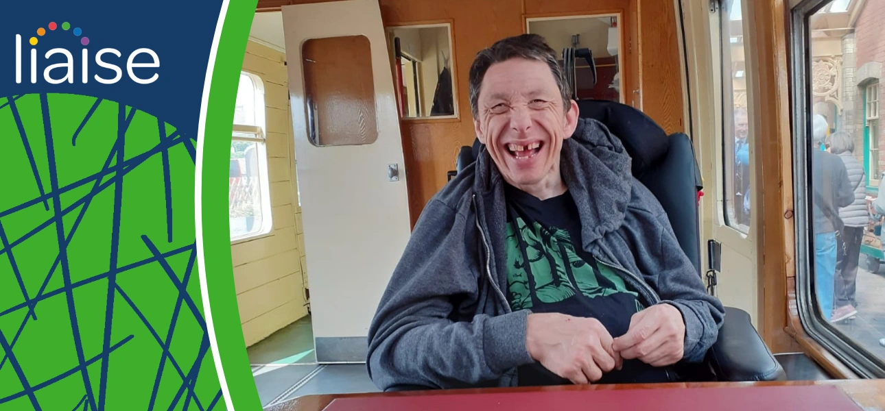 Paul smiling on the Poppy Line steam railway during a memorable day out with Liaise