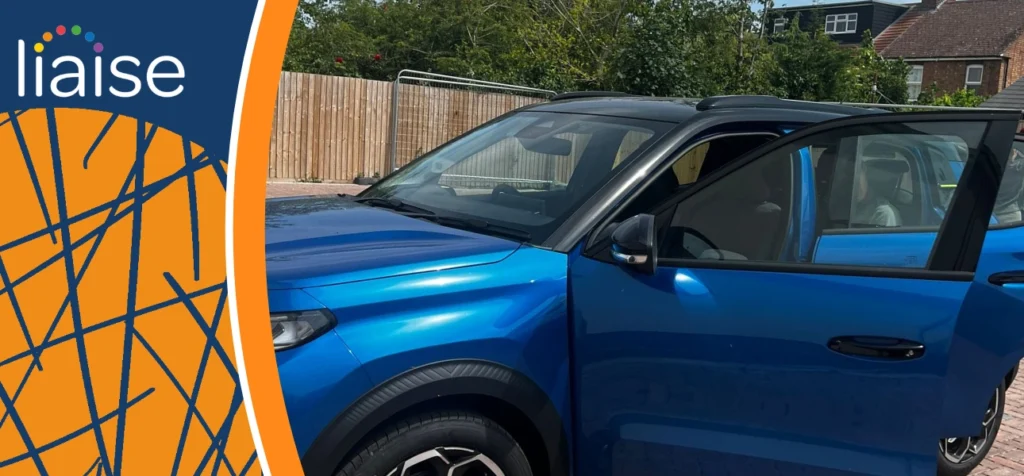 Alan enjoying his new car, supporting independence with Liaise